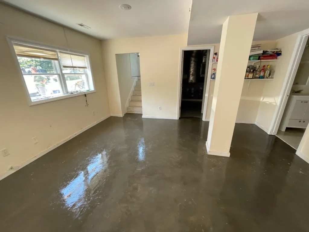 Flooded interior living space documented before extraction and drying
