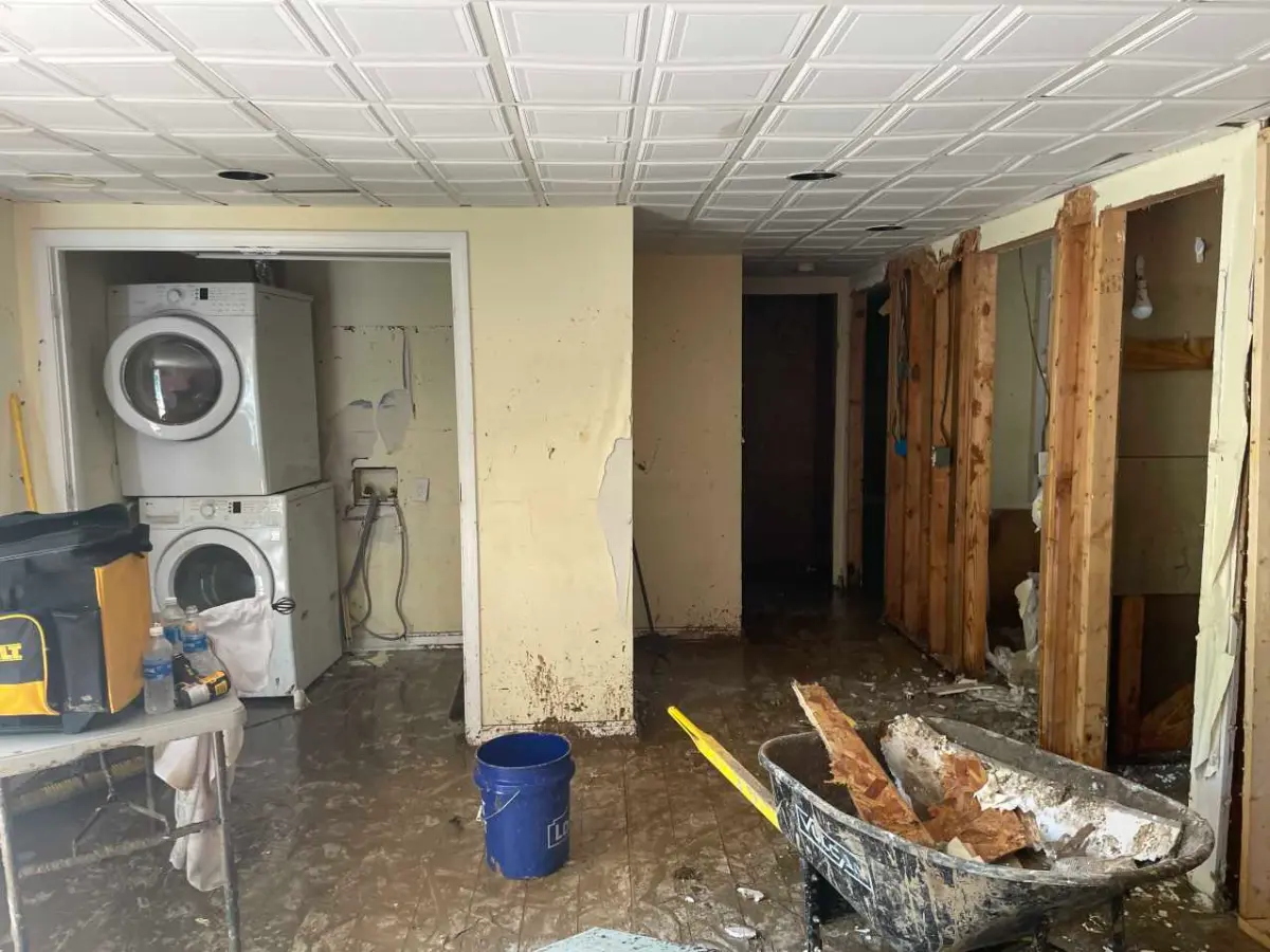 Flooded laundry room from a failed water line — a common loss in homes with aging supply plumbing