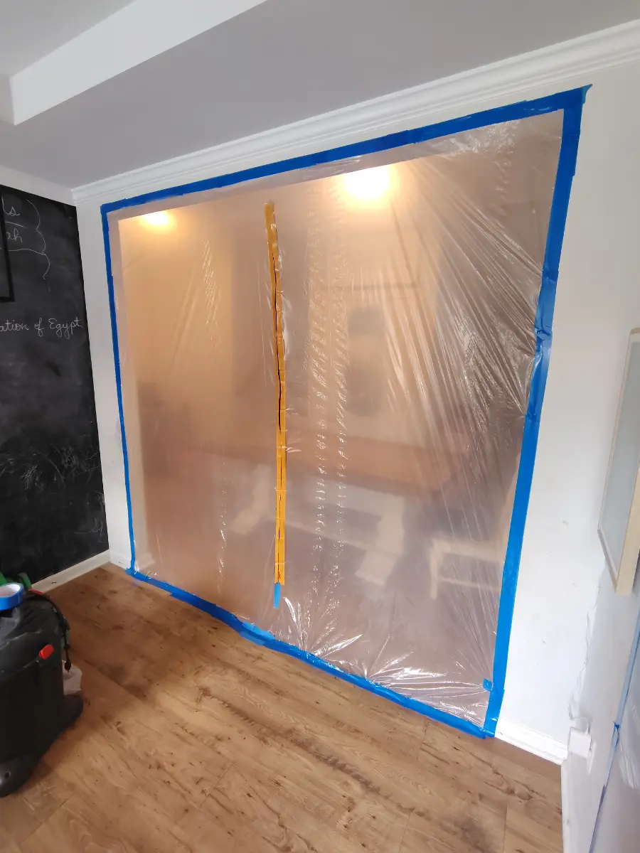 Sealed poly-sheeting containment barrier built for a mold remediation project