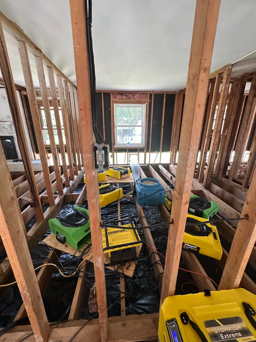 OCI Restoration air movers and dehumidifier positioned for structural drying after a residential water loss