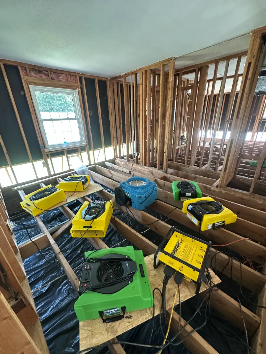 Drying equipment running in a storm-damaged room during an OCI Restoration response